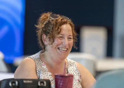 A participant smiles during the Lived Experience Committee meeting.