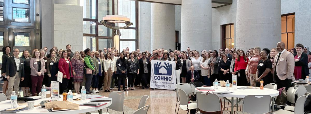 COHHIO Statehouse Advocacy Day 2026 group photo Advocates gathered with a COHHIO banner at the Ohio Statehouse for Advocacy Day 2026